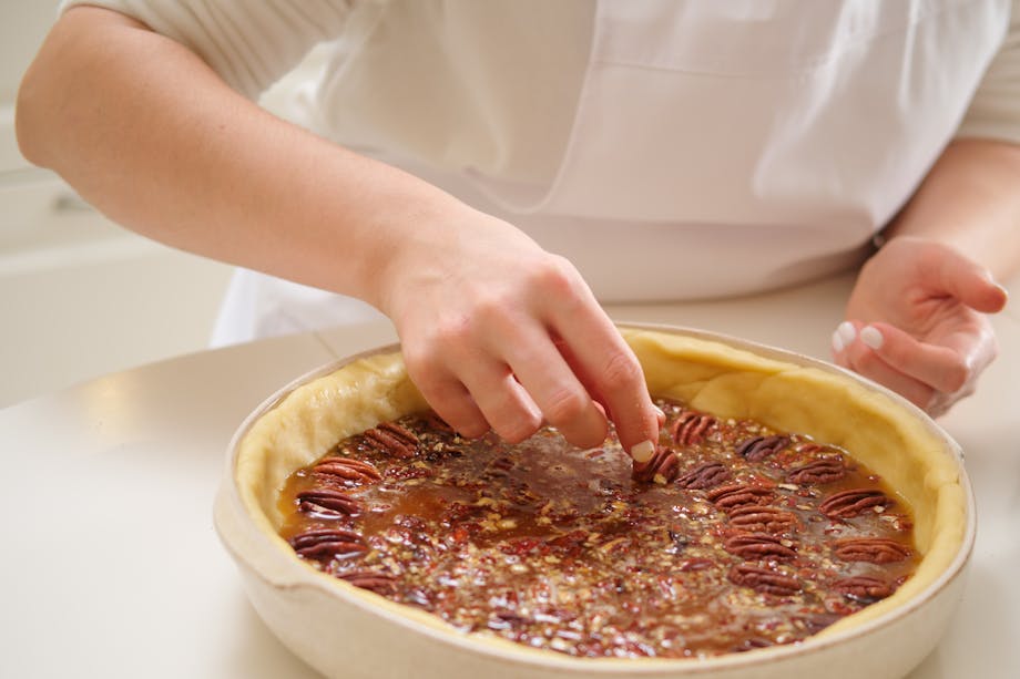 Woman cooking pecan pie