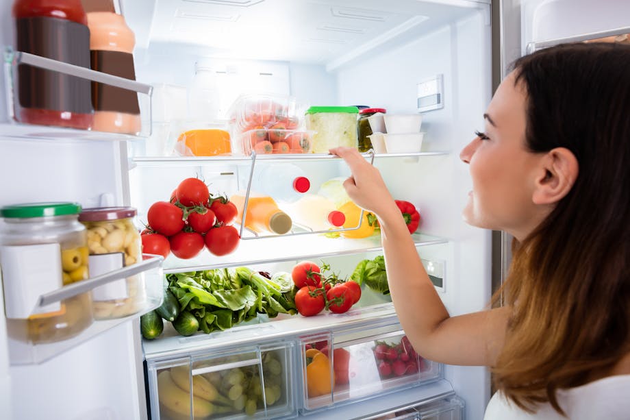 Woman looking into a fridge