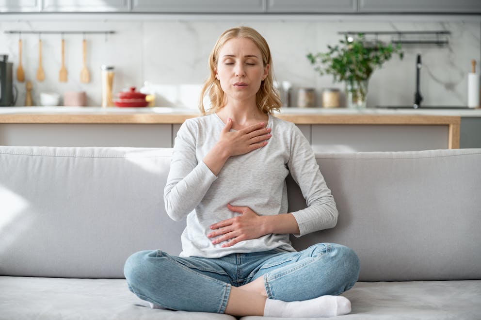 Woman practicing relaxation breathing exercise