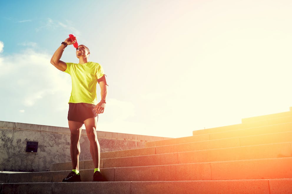 Runner drinking a sports drink