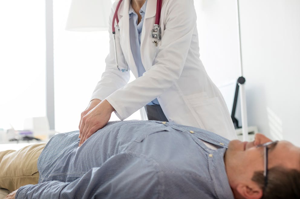 Doctor analyzing abdomen