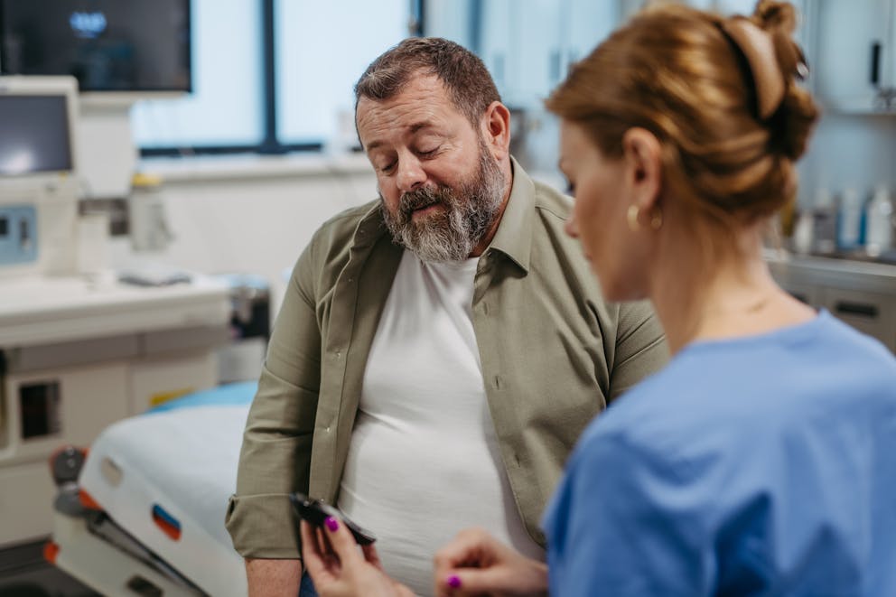 Man talking to doctor