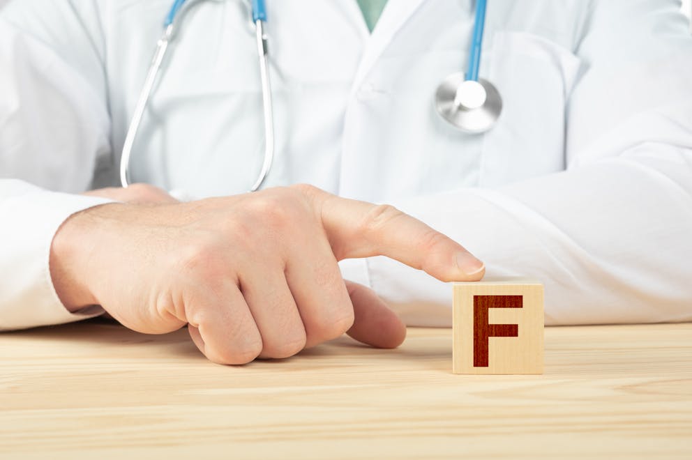 Doctor pointing to letter