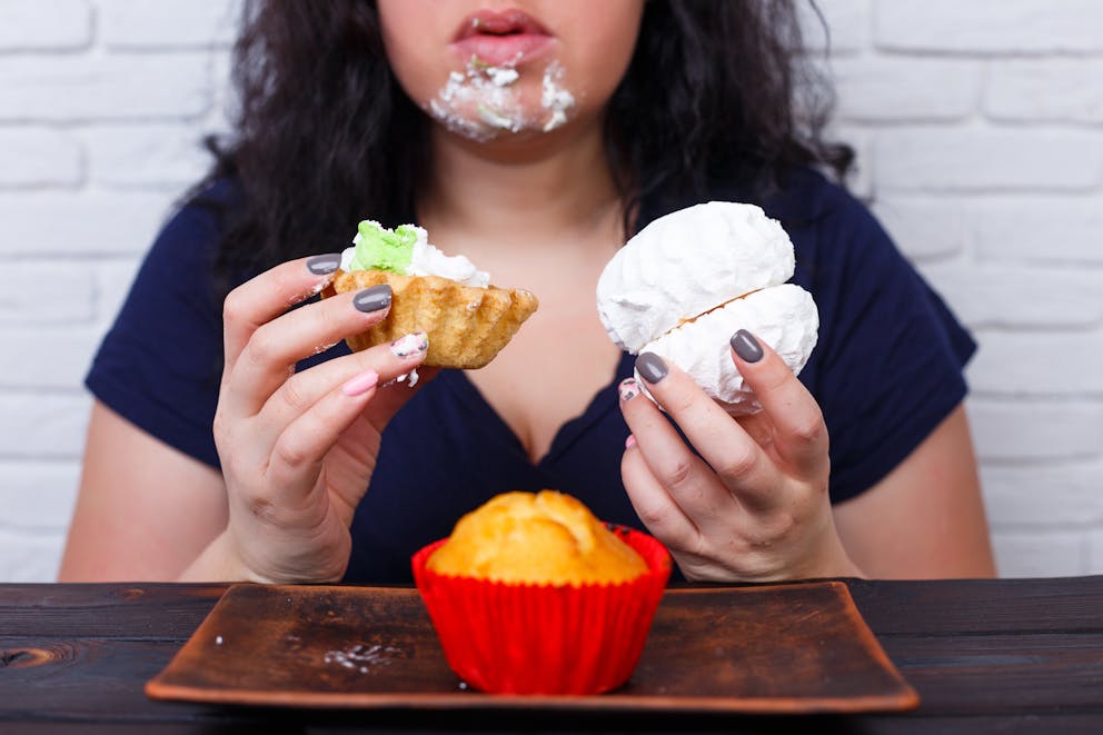 Woman eating high-sugar foods
