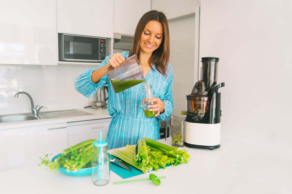 Woman preparing celery juice