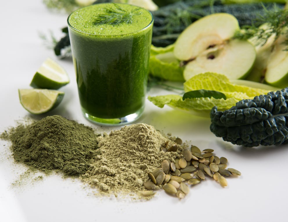 Green smoothie with kale, lettuce, and limes