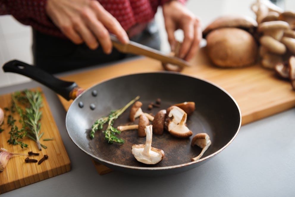 Fresh mushrooms in a frying pan