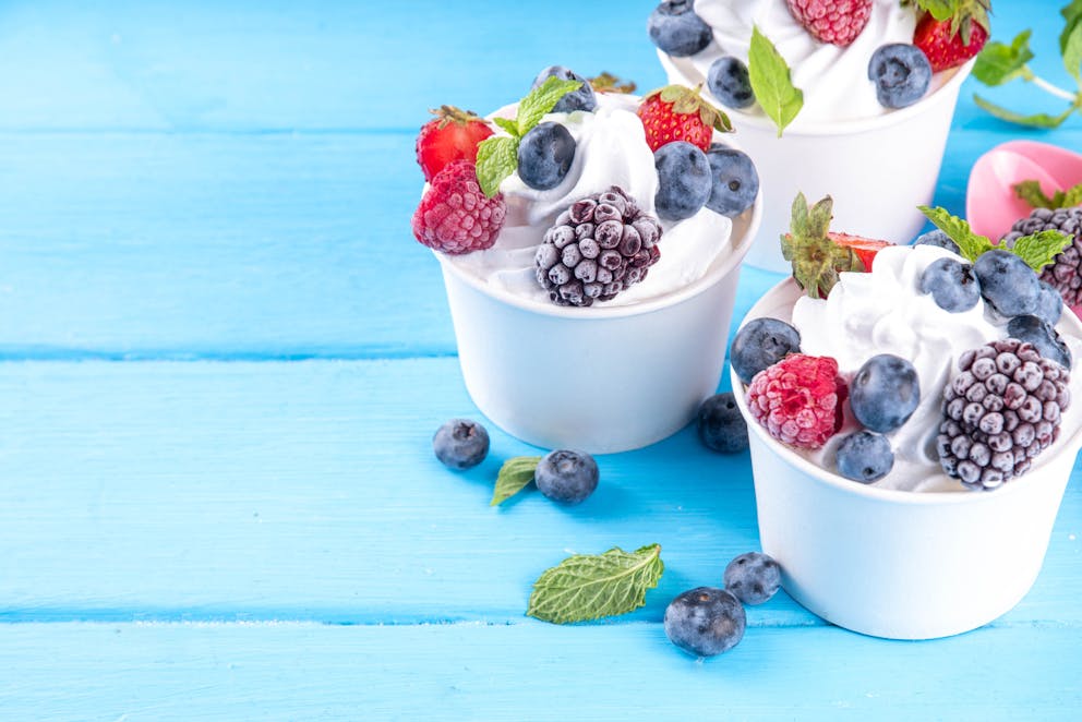 Yogurt topped with frozen berries