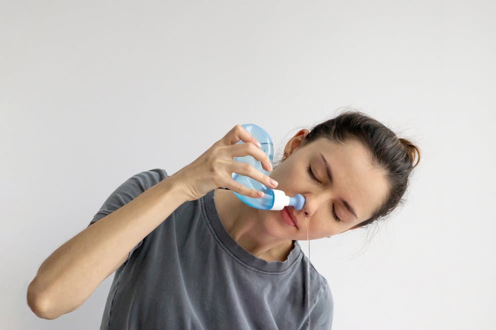 Woman doing a saline rinse