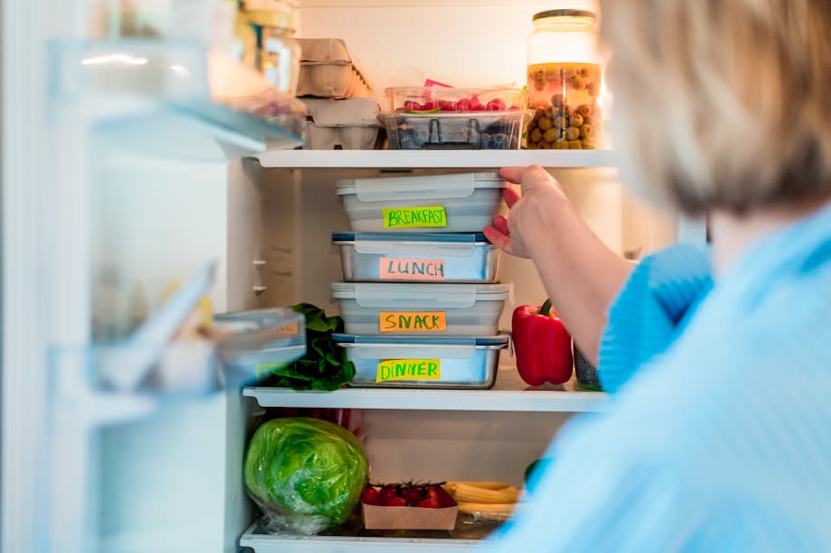 Putting food containers in the fridge