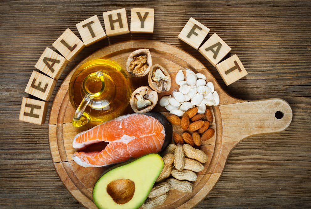 Healthy fats on a wooden table