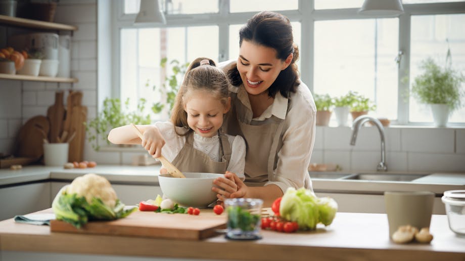 Mother and daughter cooking