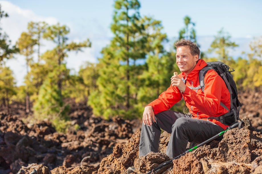 Man eating a protein bar