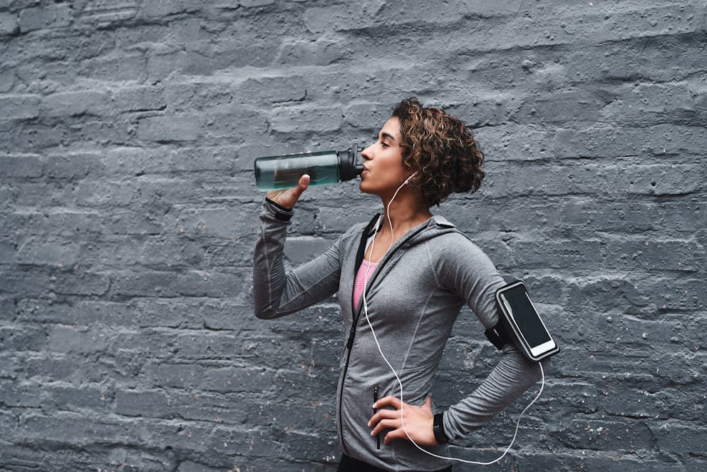 Sportswoman drinking water