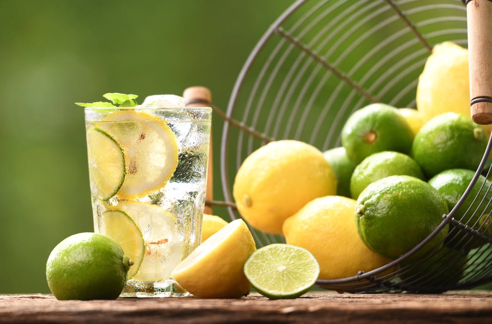 Glass with lemon and lime-infused water