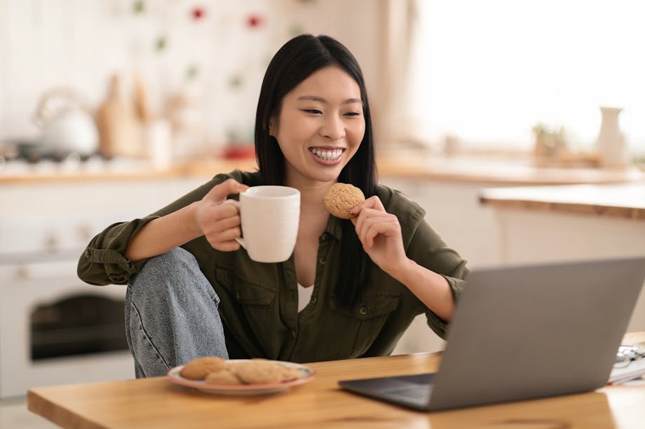 Woman eating cookie