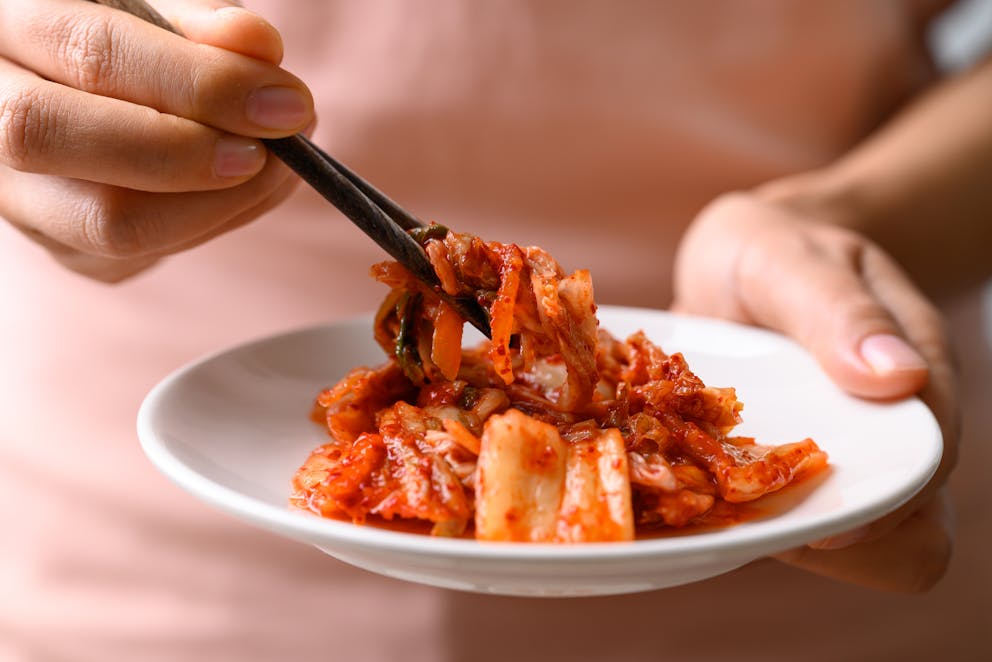 Eating kimchi with chopsticks