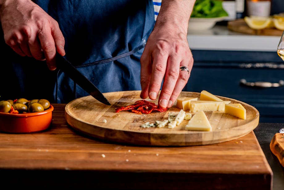 Chopping tomatoes and cheese