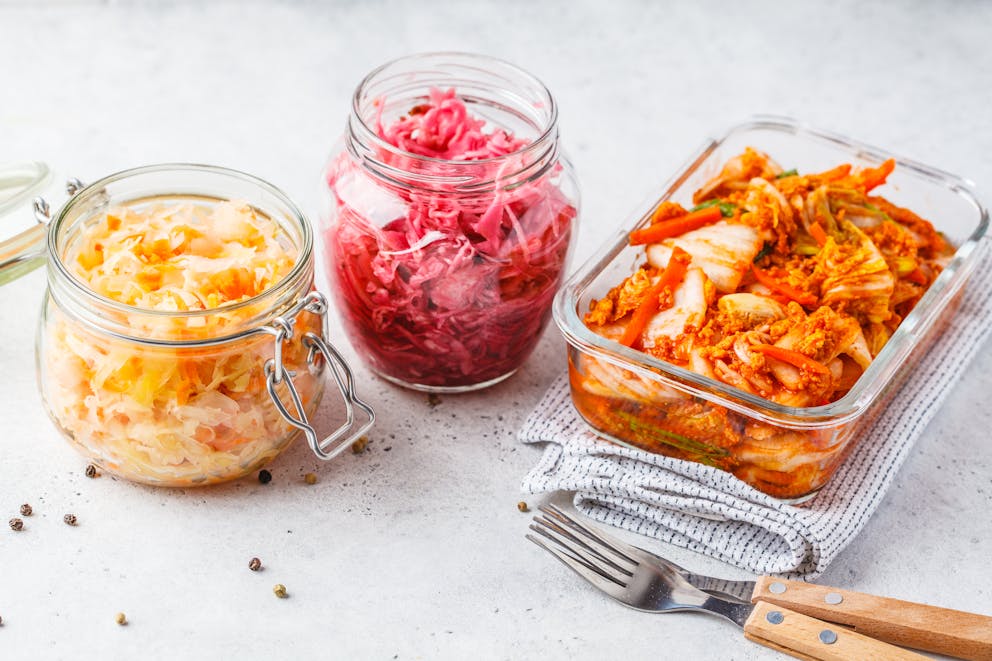 Kimchi and sauerkraut in glass jars