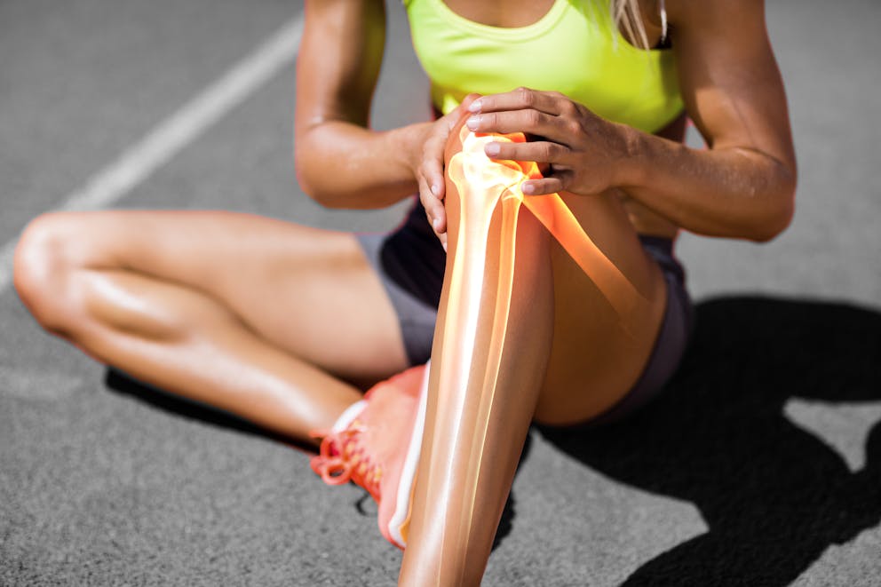 Sporty woman with knee pain