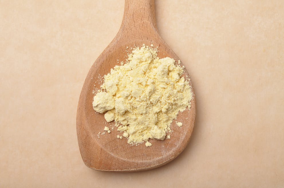 Lupin flour on a wooden spoon