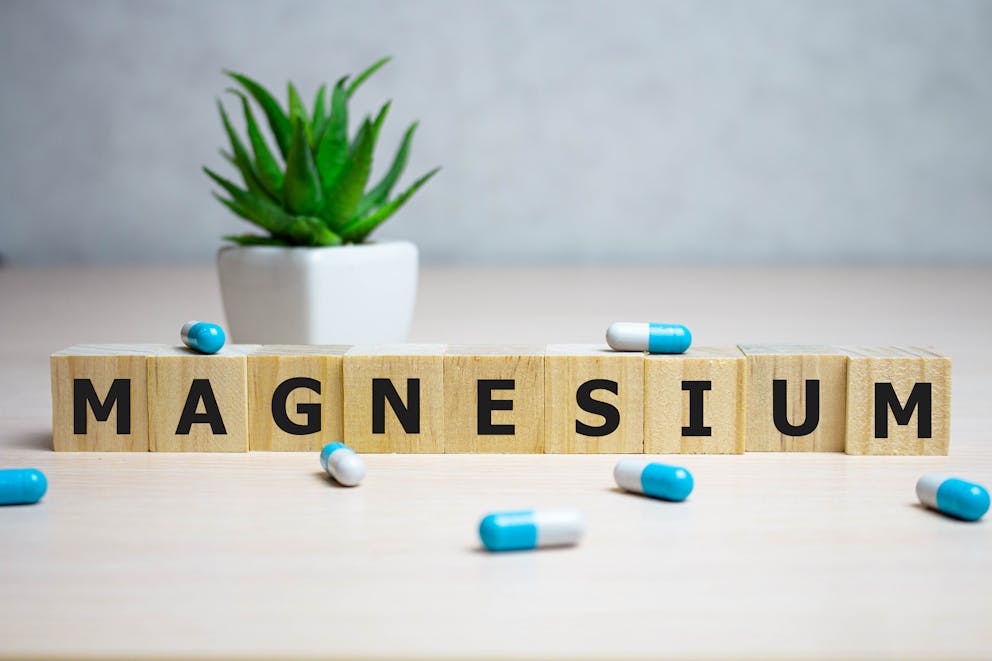Word magnesium on wooden cubes