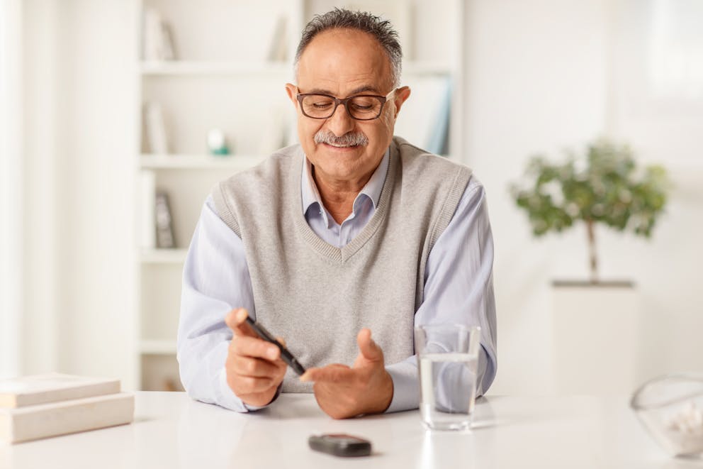 Man measuring blood sugar levels