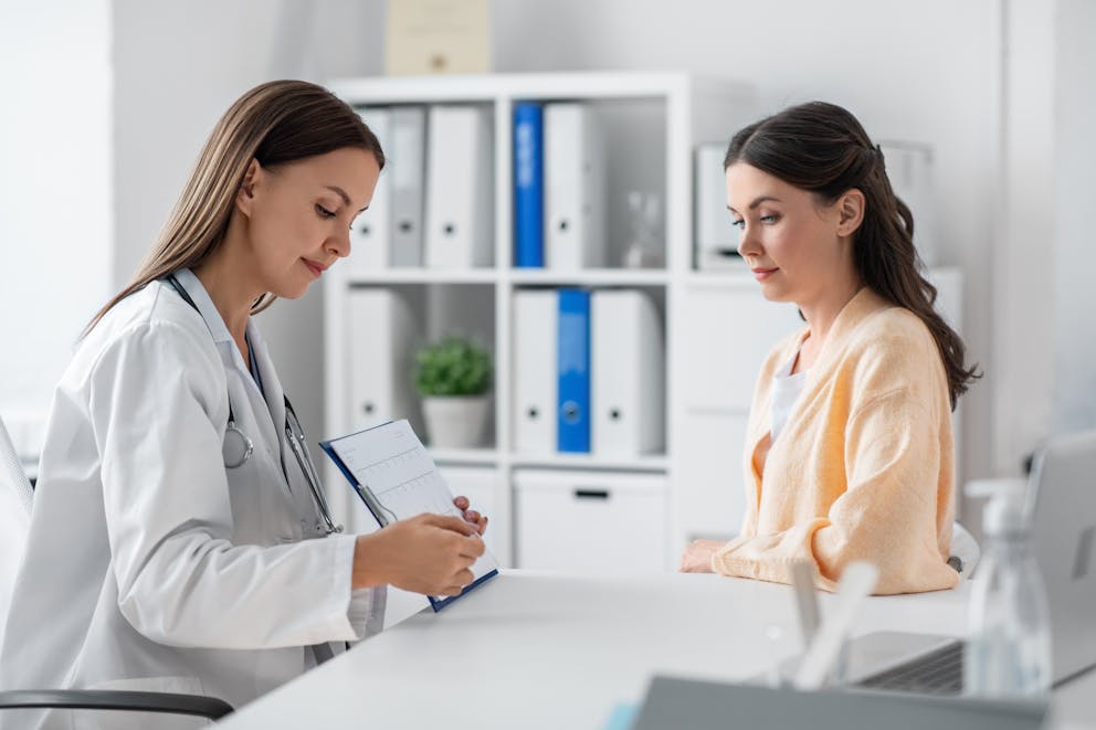 Woman talking to a doctor