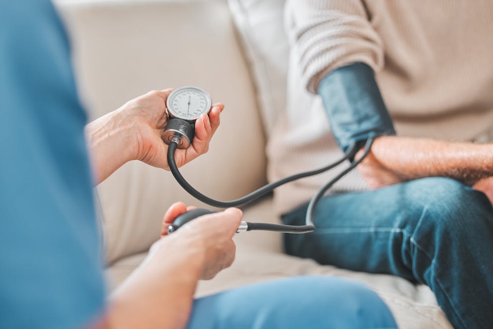 Nurse taking blood pressure