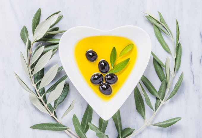 Olive oil in heart-shaped bowl