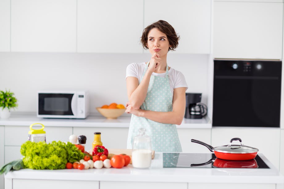 Woman deciding what to cook