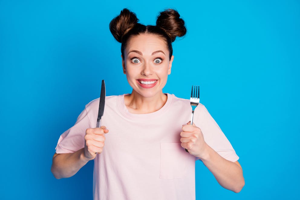 Woman holding silverware