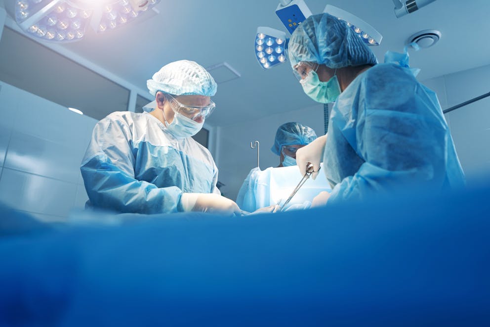 Surgeons performing gastric sleeve surgery
