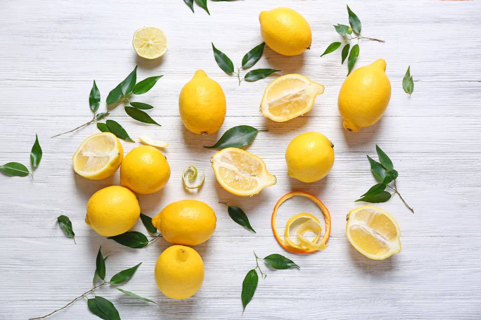 Sliced lemons and lemon peels
