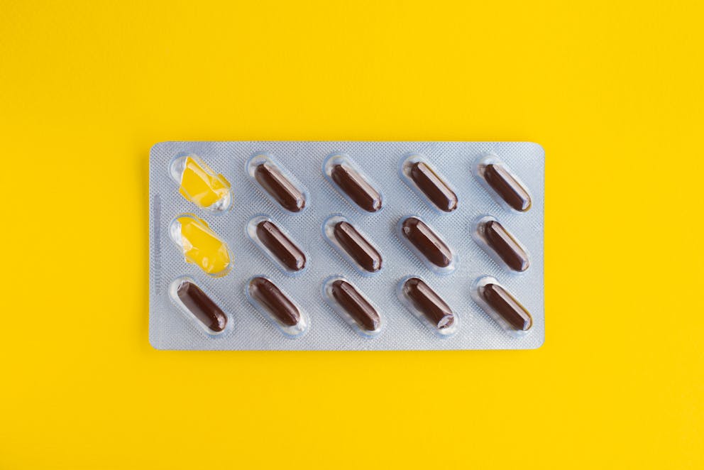 Blister pack on yellow background