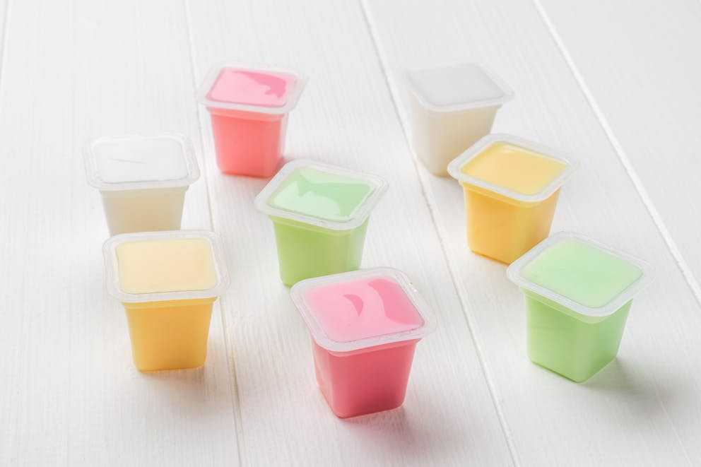 plastic cups of sugary yogurt