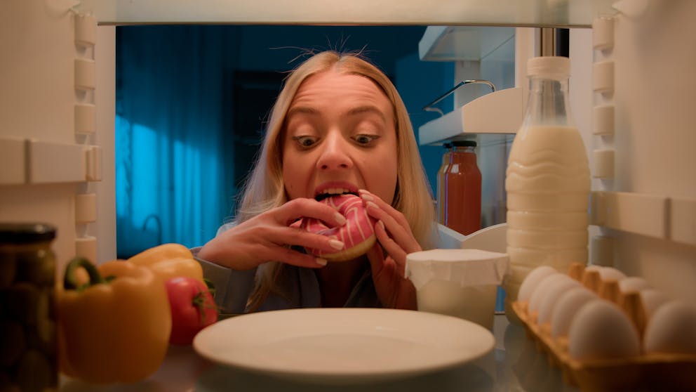 Woman eating a donut