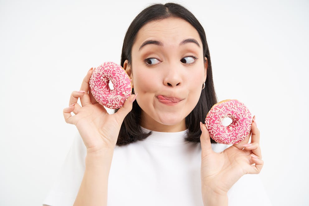 Woman eating donuts