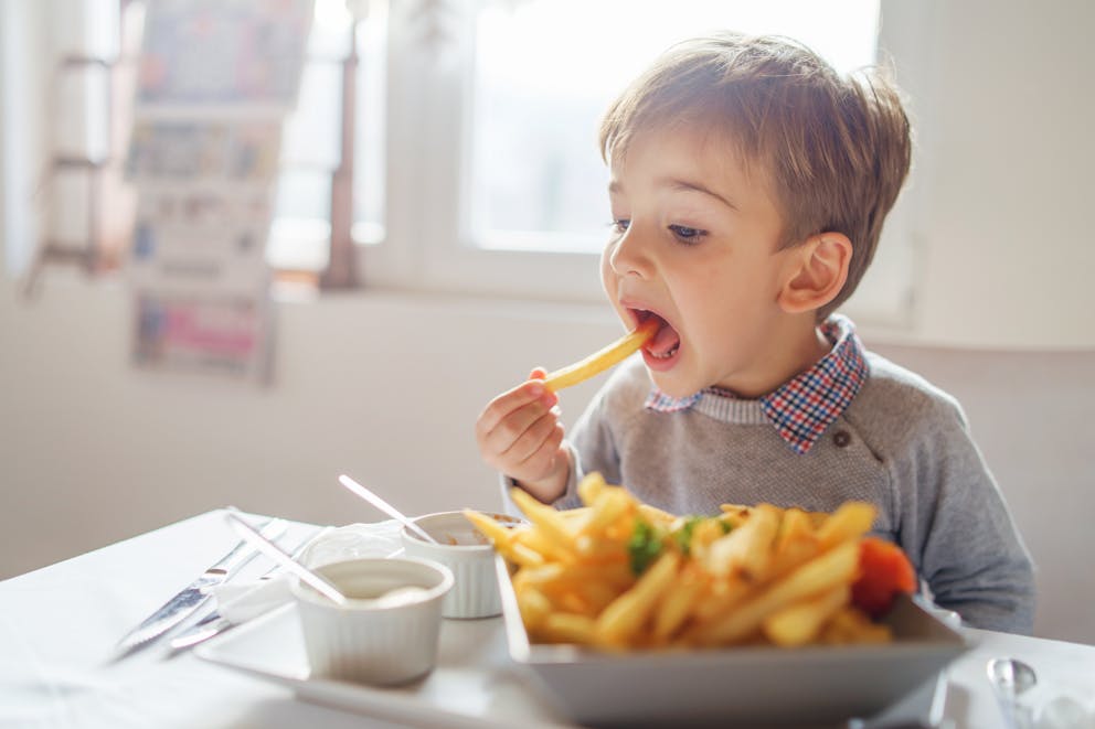 Boy eating fries