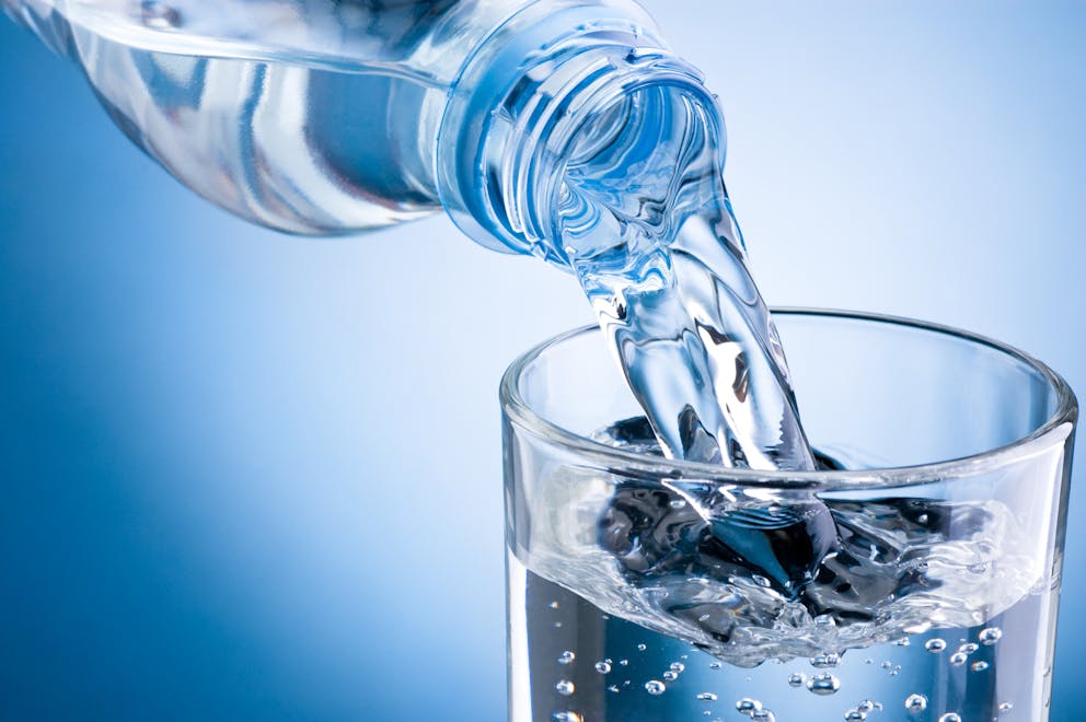 Mineral water poured into a glass