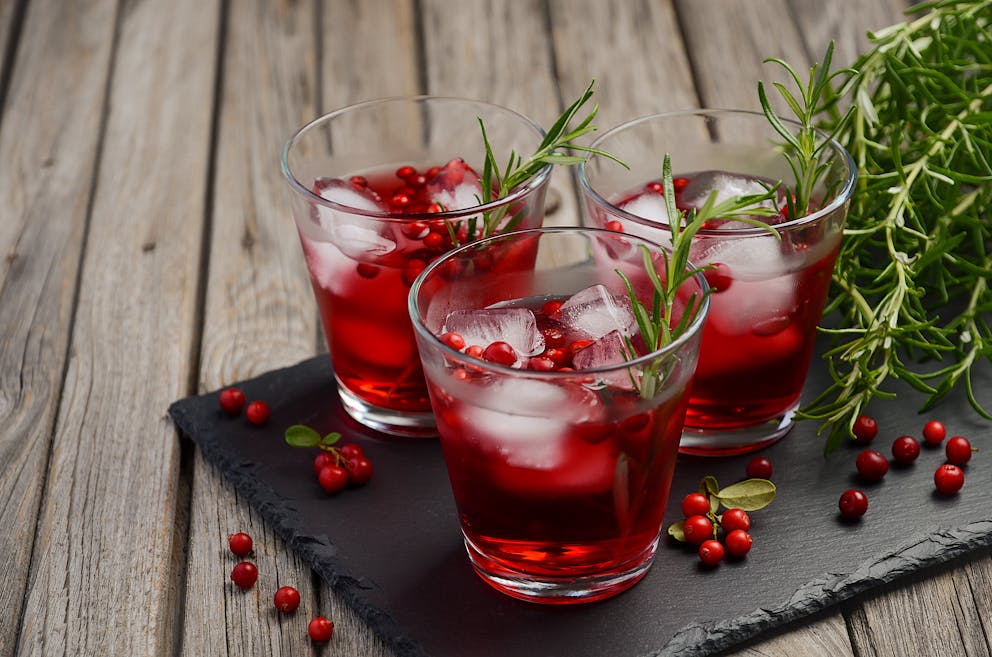 Cranberry juice with rosemary sprigs