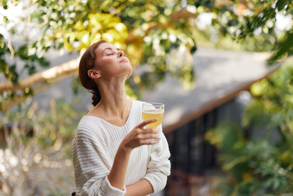 Woman holding kombucha