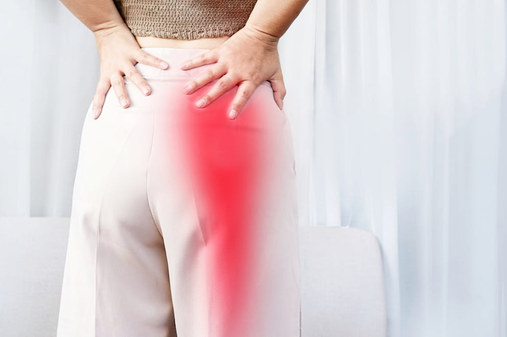 Woman with sciatica pain