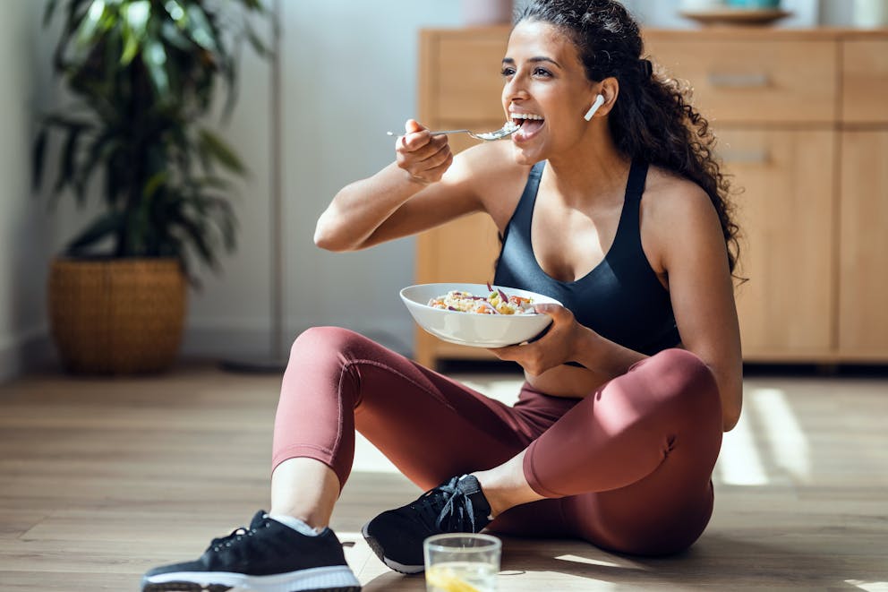 Fit woman eating