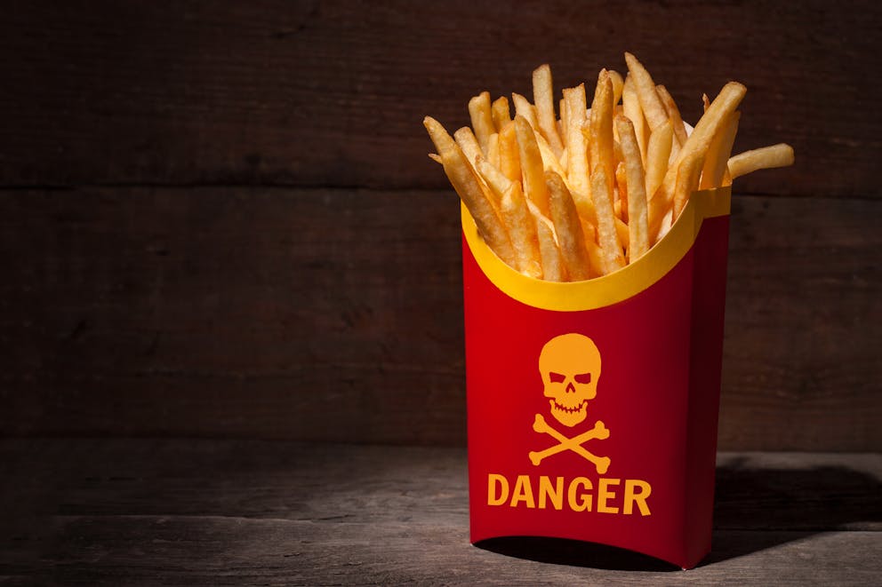 French fries with danger sign