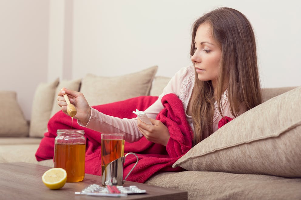 Sick woman using honey