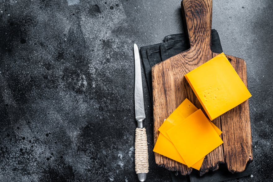 What Is the Difference between American and Cheddar Cheese?