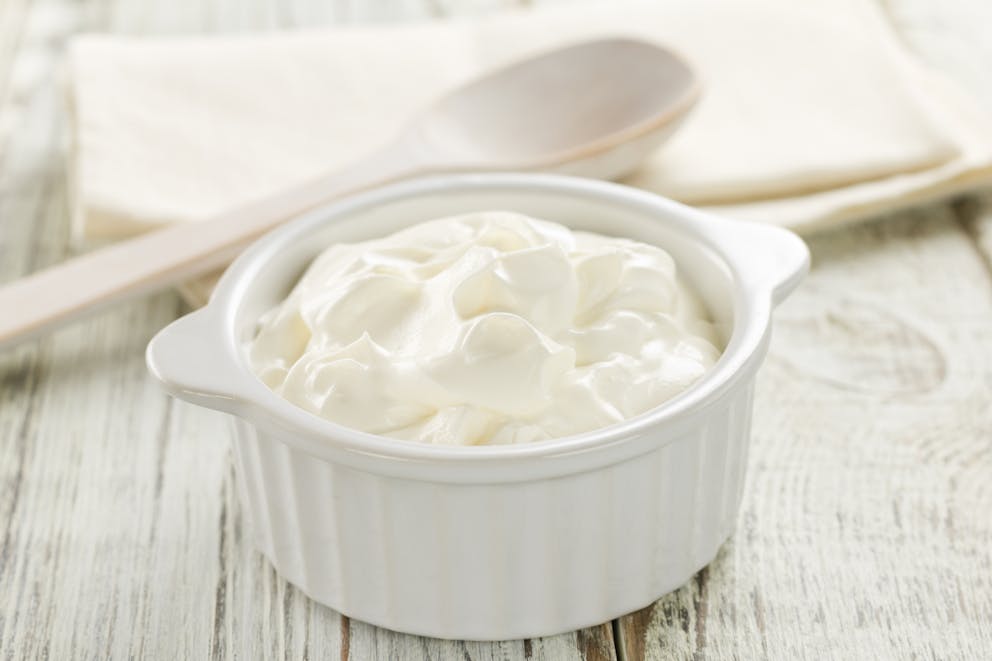 Sour cream in a white dish