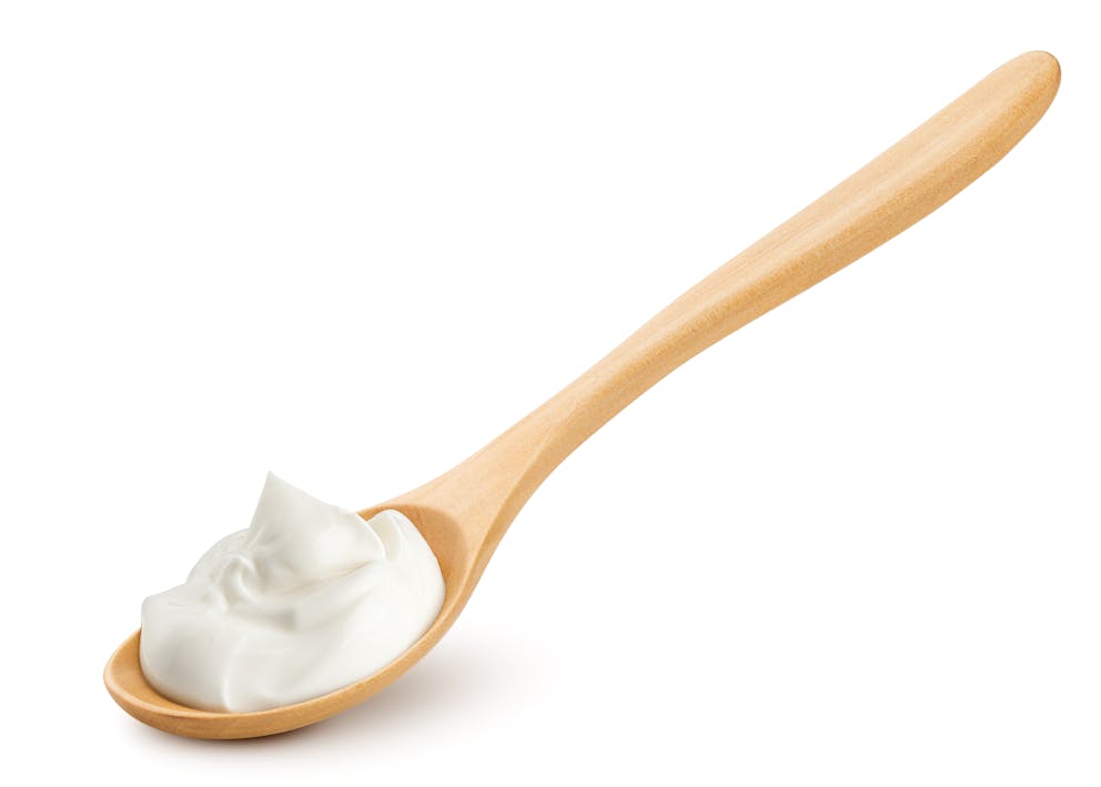 Yogurt on a wooden spoon