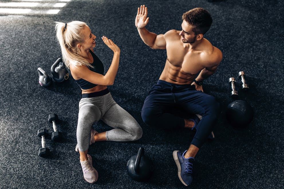 muscular couple working out